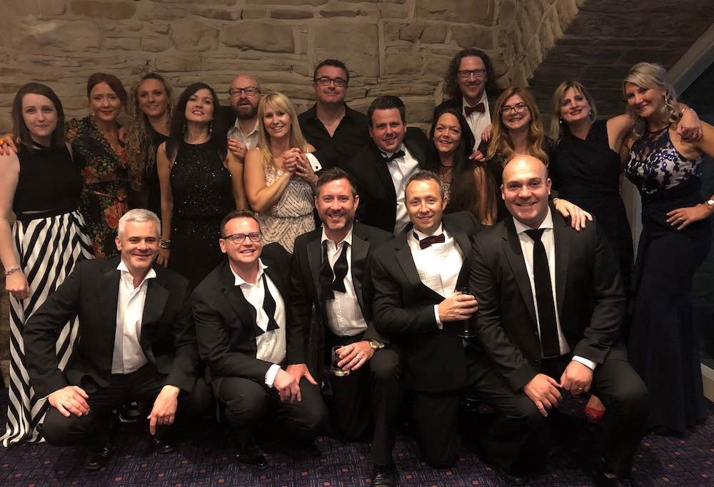 Belmayne partner, Ben Smalley (front row, second left) and guests at the firm’s charity ball