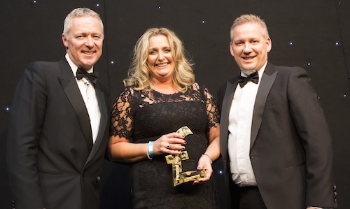 L-R: Host Rory Bremner, PFS Chartered Financial Planner of the Year Kathryn Gannon, NS&I's Andrew Pike, sponsor of the award