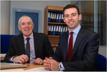 Greg Robertson (R) with University of Huddersfield finance director Andrew McConnell