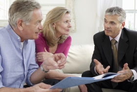 Older couple discussing finances with Planner