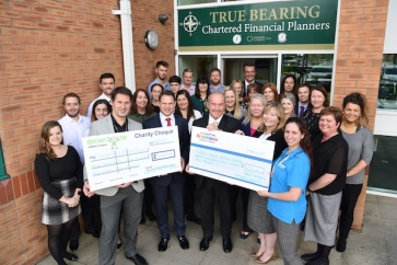 Directors and staff of True Bearing handing over their fundraising to Derian and Brian House Children’s Hospice 